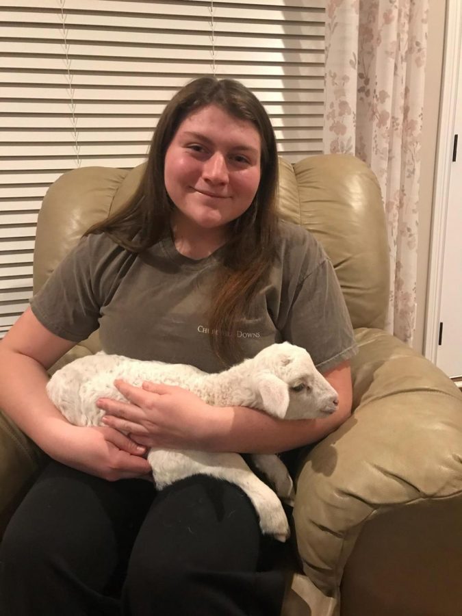Sydney Fitzpatrick enjoys spending time with sweet little lamb Lucky. 